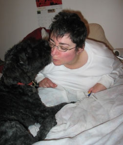 Barnum at 5 months kissing Sharon on bed