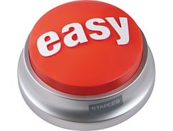 Round raised bright red button says "Easy" in white letters on the top. The base is metal and says, "Staples" on one side.